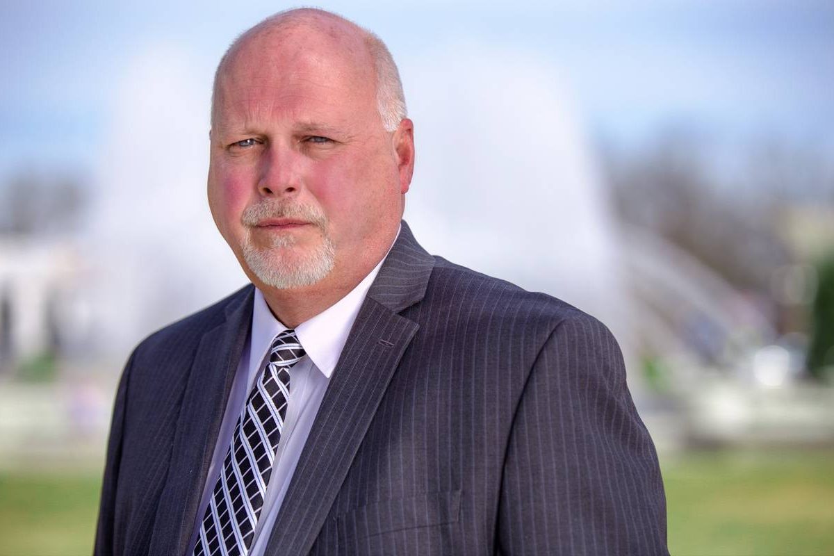 Pete Skidmore Senior's headshot wearing a blue suit