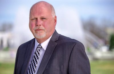 Pete Skidmore Senior's headshot wearing a blue suit